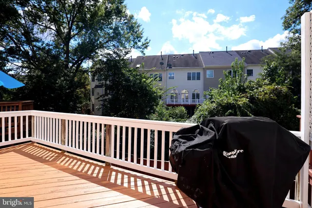 a bedroom with a balcony a bed and a flat screen television