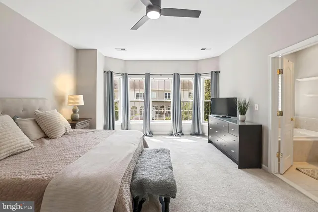 a bathroom with a sink a toilet and shower curtain