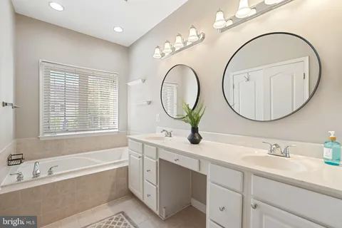 a living room with furniture a fireplace and a window