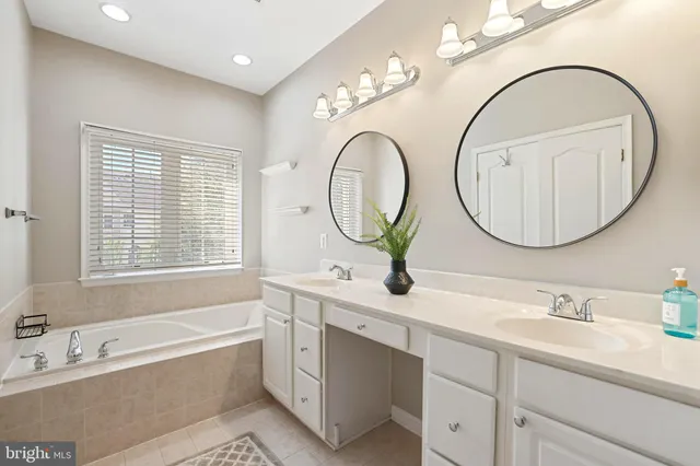 a living room with furniture a fireplace and a window