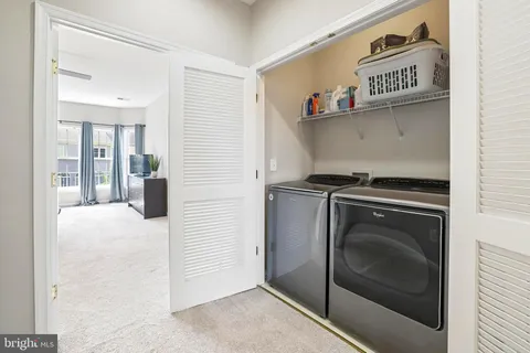 a view of balcony with wooden floor and outdoor seating