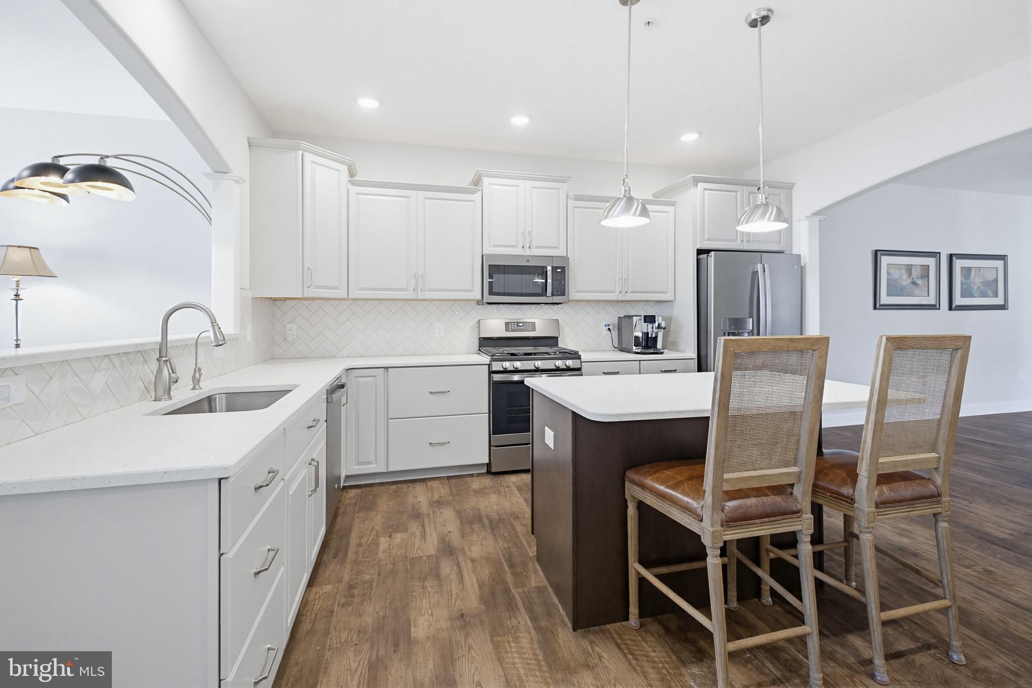 361 Meadow Rose Drive Lititz, PA 17543 - Photo 12 of 39 a kitchen with a table chairs sink and cabinets