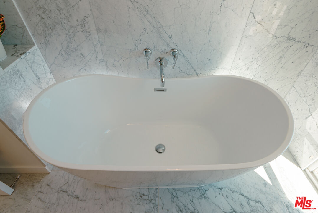 20647 Seaboard Road Malibu, CA 90265 - Photo 11 of 35 a white bath tub sitting in a bathroom