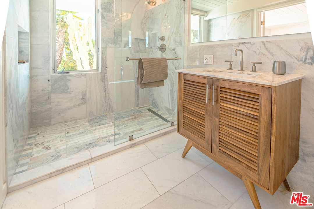 20647 Seaboard Road Malibu, CA 90265 - Photo 19 of 35 a bathroom with a sink and a shower