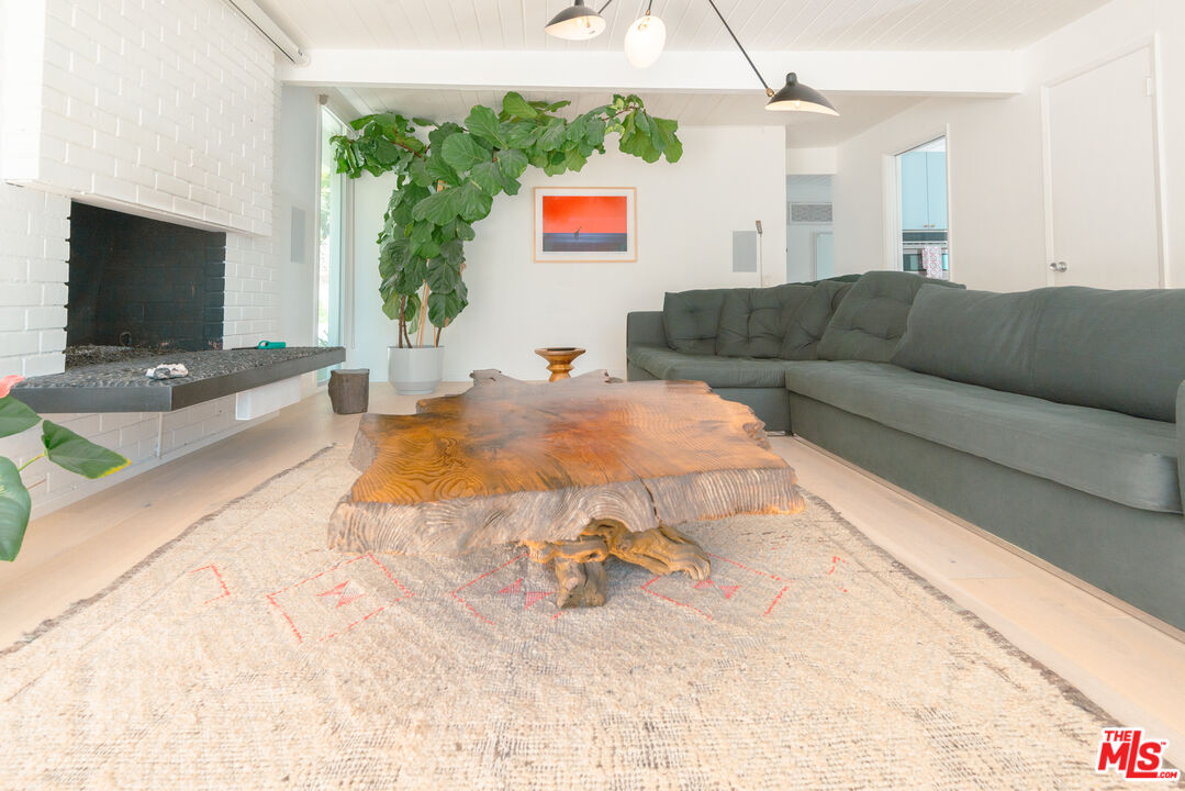 20647 Seaboard Road Malibu, CA 90265 - Photo 20 of 35 a living room with furniture and a flat screen tv