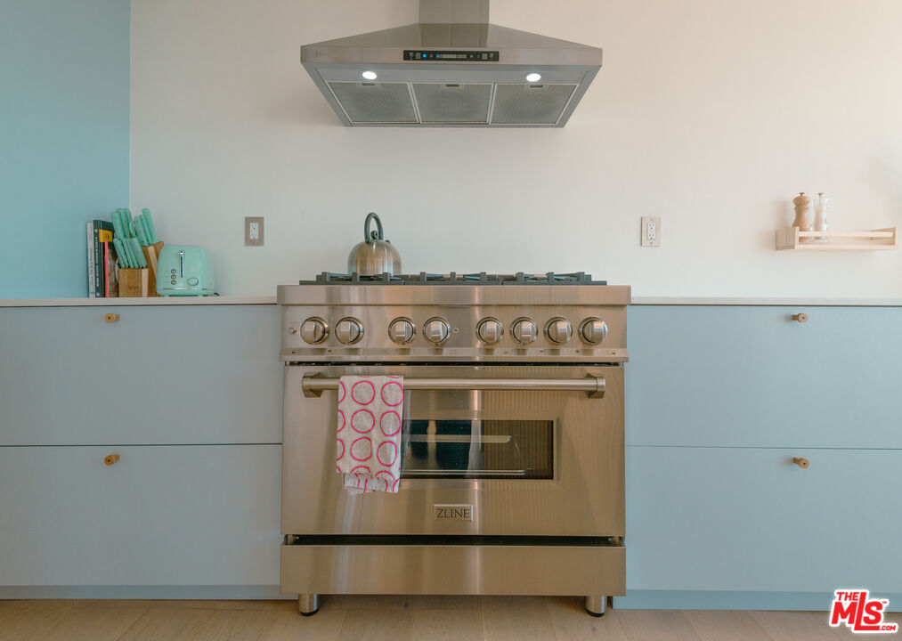 20647 Seaboard Road Malibu, CA 90265 - Photo 22 of 35 a stove top oven sitting inside of a kitchen