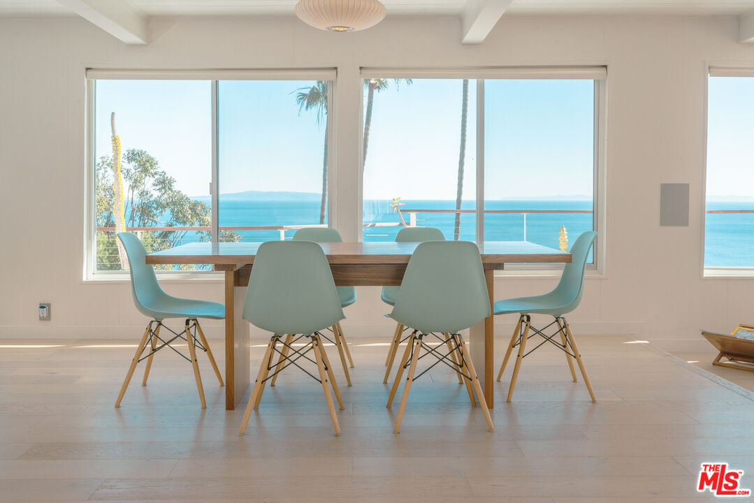 20647 Seaboard Road Malibu, CA 90265 - Photo 26 of 35 a view of a dining room with furniture window and outside view