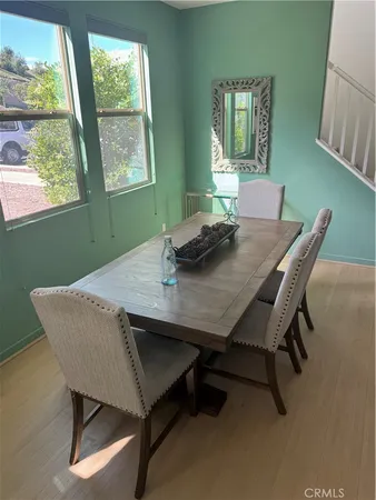 a view of a dining room with furniture and window