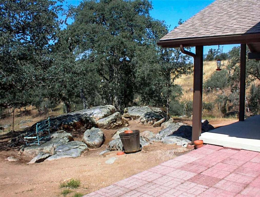32860 George Smith Road Squaw Valley, CA 93675 - Photo 6 of 35 a view of a patio with table and chairs under an umbrella