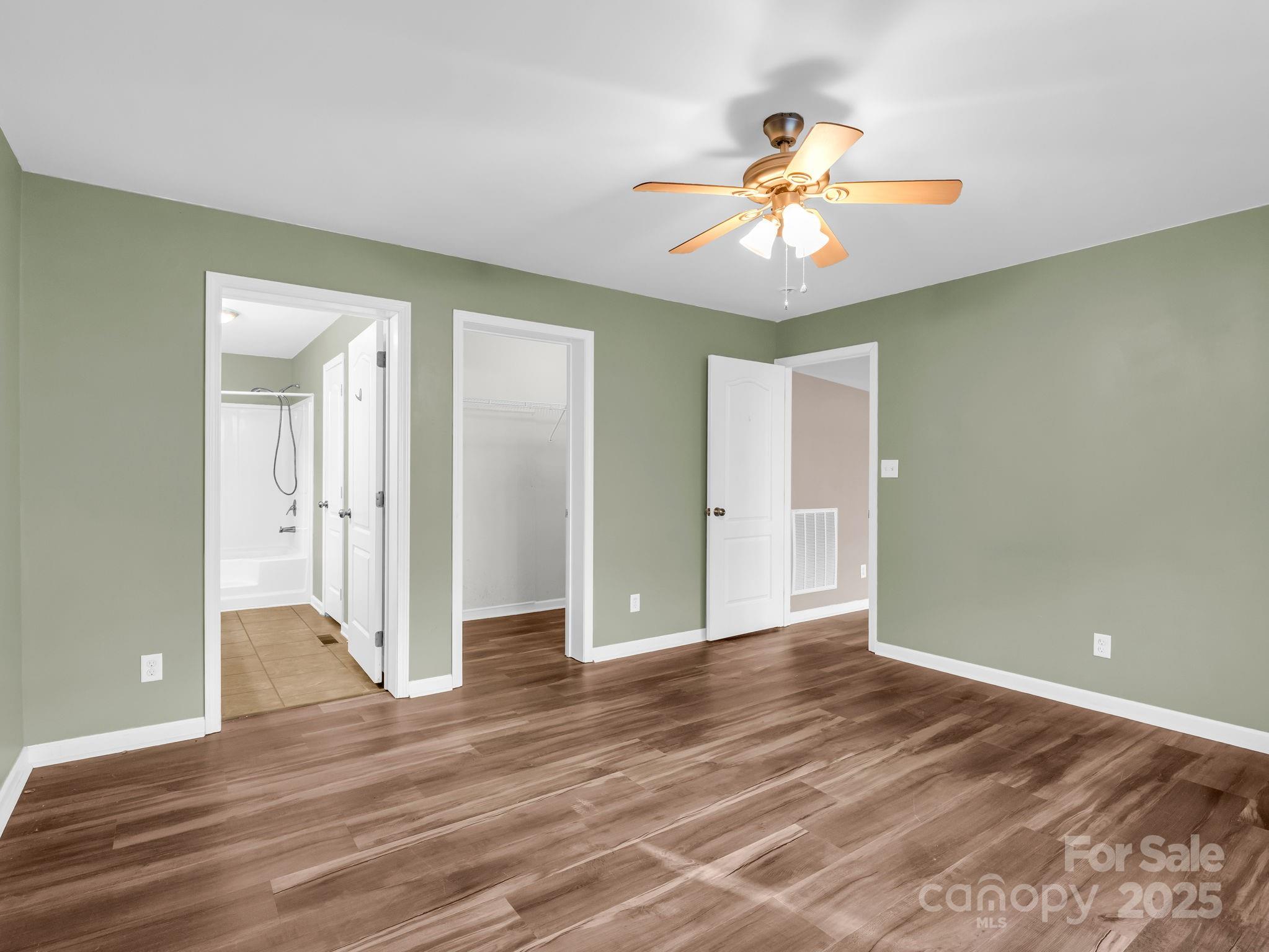663 Landrum Road Columbus, NC 28722 - Photo 14 of 40 wooden floor in an empty room with a window