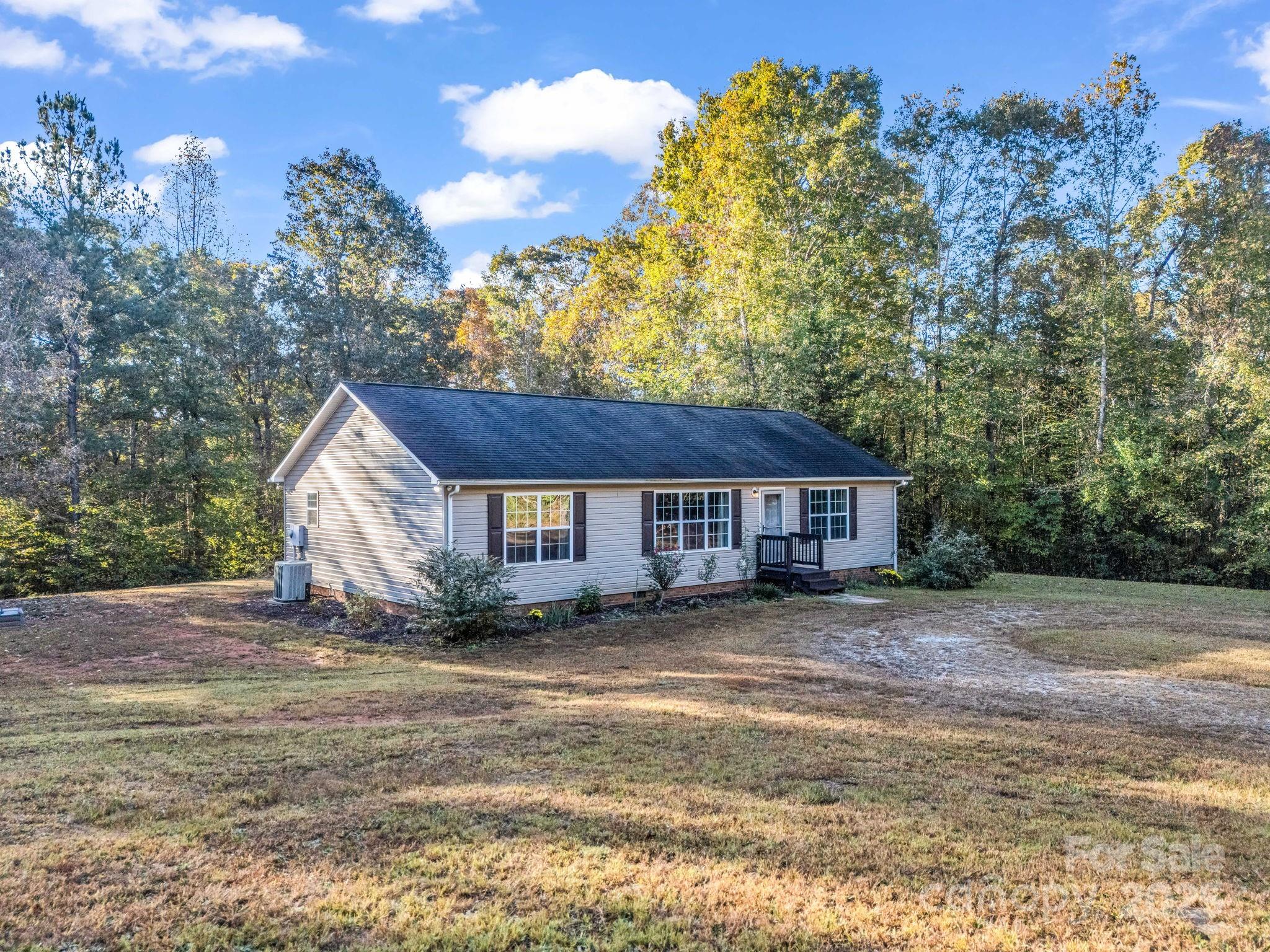 663 Landrum Road Columbus, NC 28722 - Photo 39 of 40 a view of a house with a yard