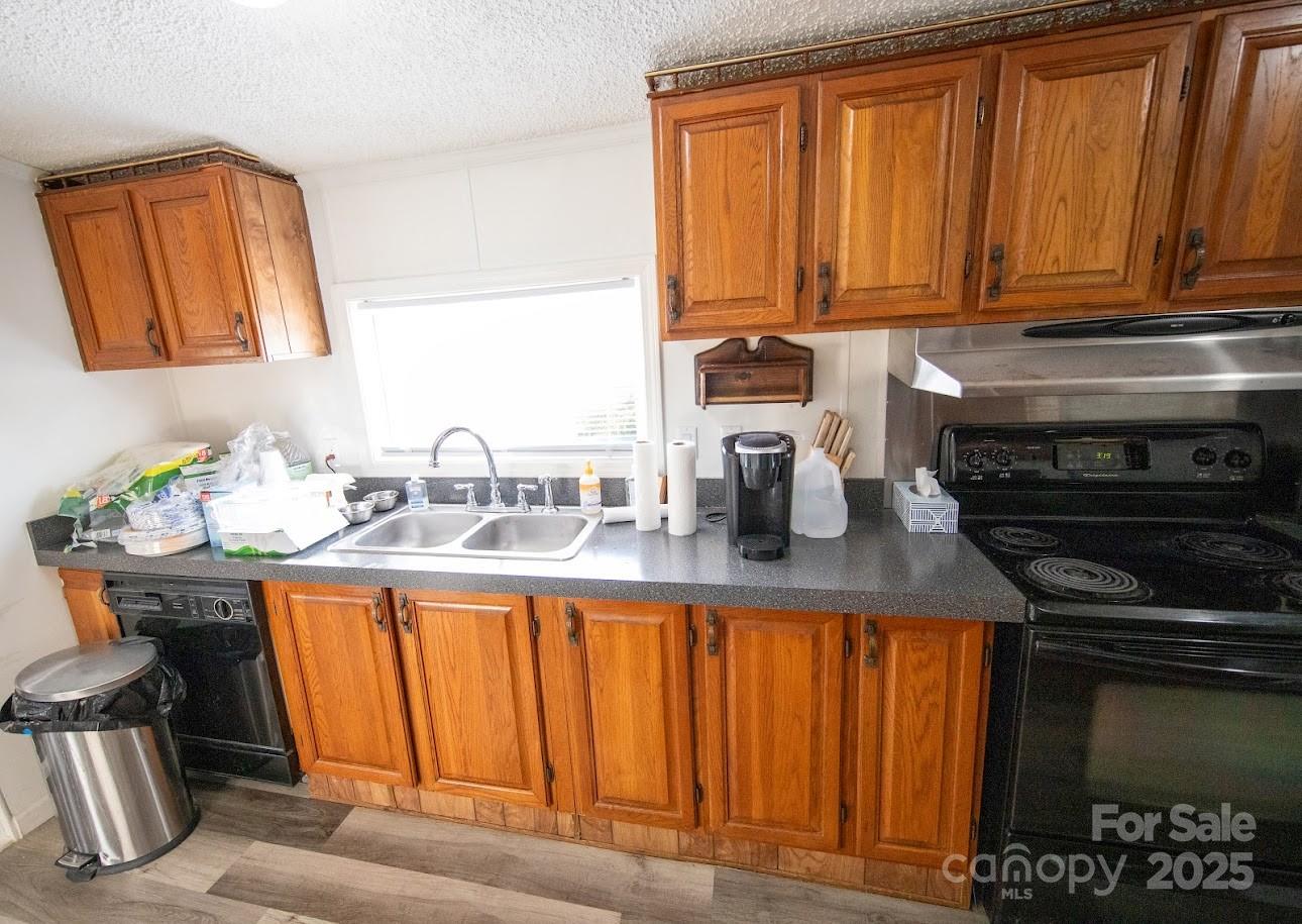 717 Pine Mountain Road Hudson, NC 28638 - Photo 18 of 31 a kitchen with a sink cabinets and appliances