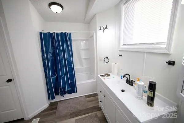 a view of bathroom with dual sinks