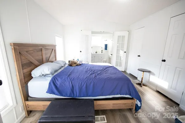 a bedroom with a bed and window
