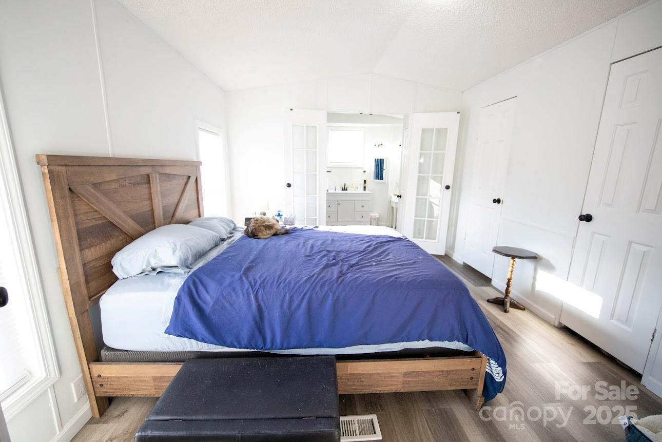 717 Pine Mountain Road Hudson, NC 28638 - Photo 22 of 31 a bedroom with a bed and window