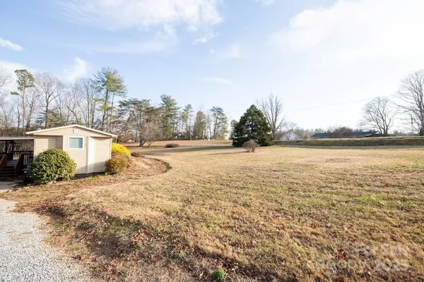 a view of an ocean with a building in the background