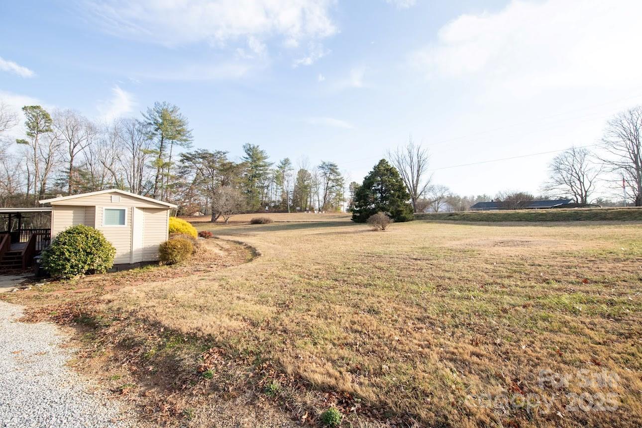 717 Pine Mountain Road Hudson, NC 28638 - Photo 6 of 31 a view of an ocean with a building in the background