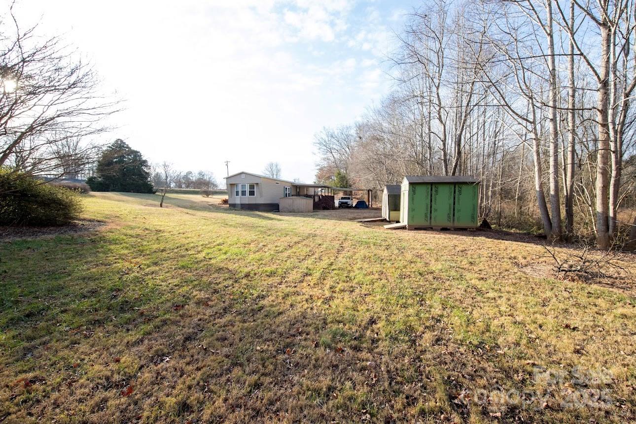 717 Pine Mountain Road Hudson, NC 28638 - Photo 9 of 31 a view of a yard with an outdoor space