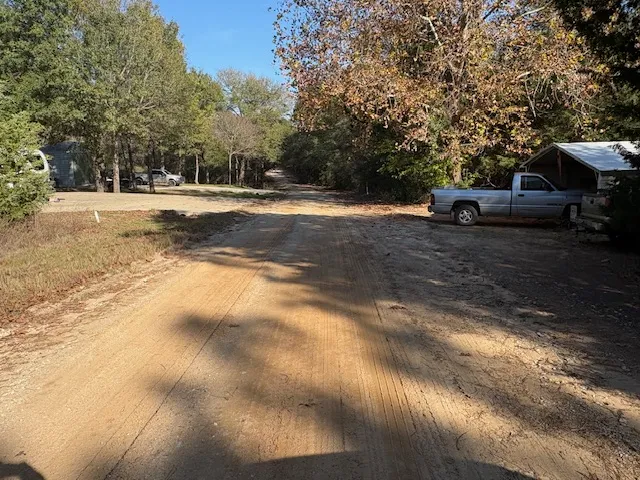 a view of road with trees