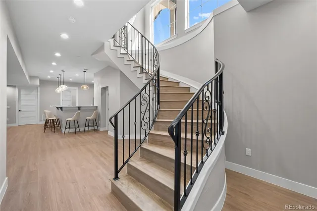 a view of entryway with wooden floor and stairs