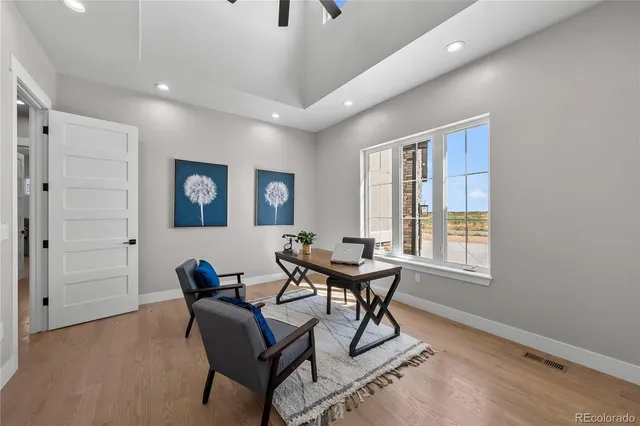 a view of a livingroom with furniture and windows