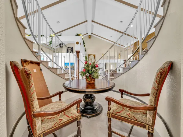 a living room with furniture and a table