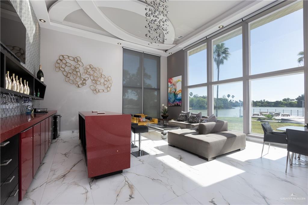 1500 Coffee Port Road Brownsville, TX 78521 - Photo 13 of 42 a living room with furniture and a floor to ceiling window