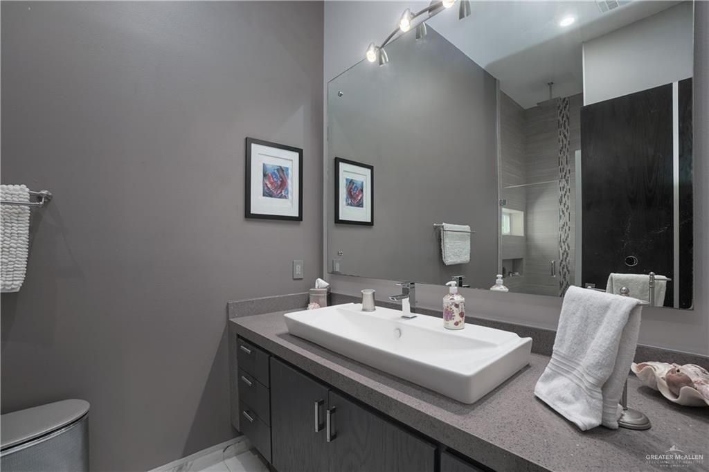 1500 Coffee Port Road Brownsville, TX 78521 - Photo 15 of 42 a view of bathroom with sink and mirror