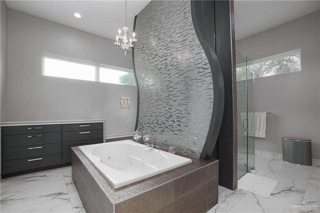 1500 Coffee Port Road Brownsville, TX 78521 - Photo 22 of 42 a bathroom with a sink a toilet and vanity