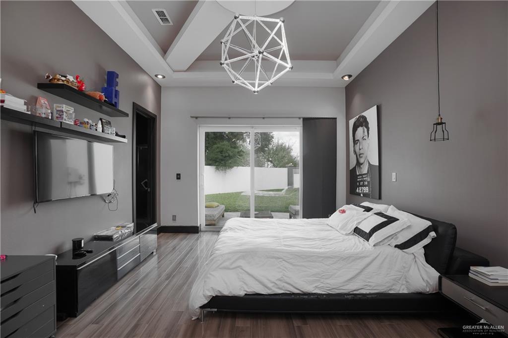 1500 Coffee Port Road Brownsville, TX 78521 - Photo 24 of 42 a bedroom with a bed and a large window