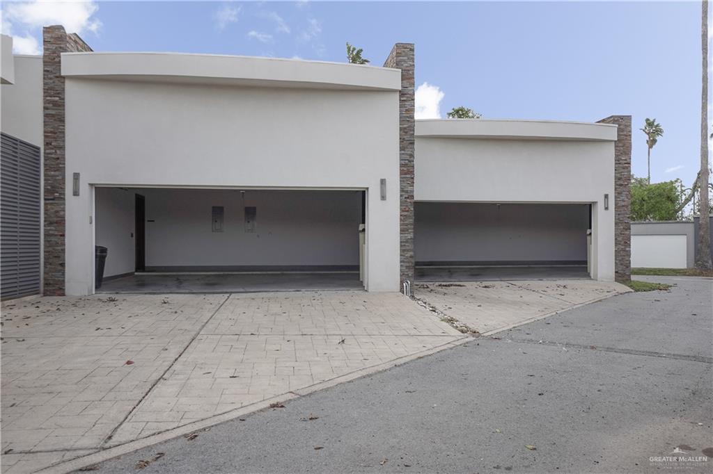 1500 Coffee Port Road Brownsville, TX 78521 - Photo 28 of 42 a front view of a house with garage