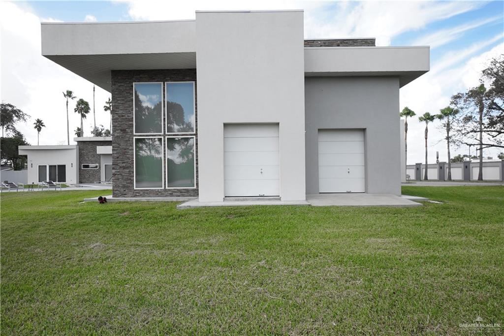 1500 Coffee Port Road Brownsville, TX 78521 - Photo 29 of 42 a house view with a garden space
