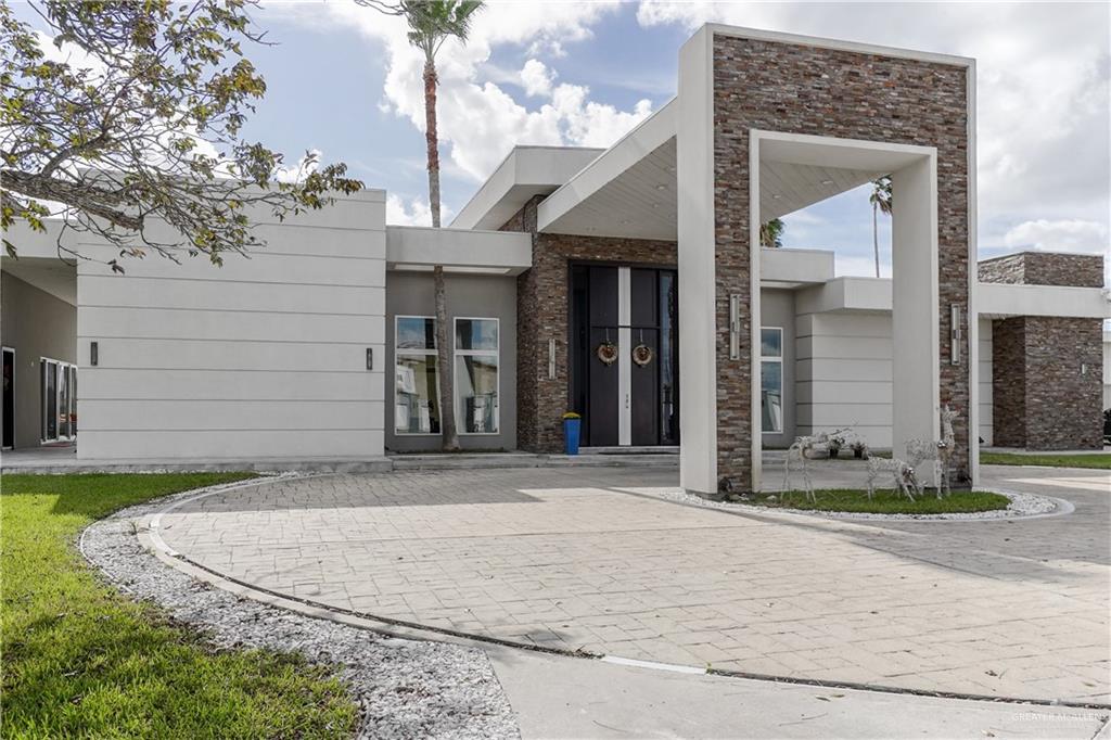 1500 Coffee Port Road Brownsville, TX 78521 - Photo 3 of 42 a view of a white house with a sink and a yard