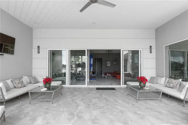 a living room with furniture and white walls