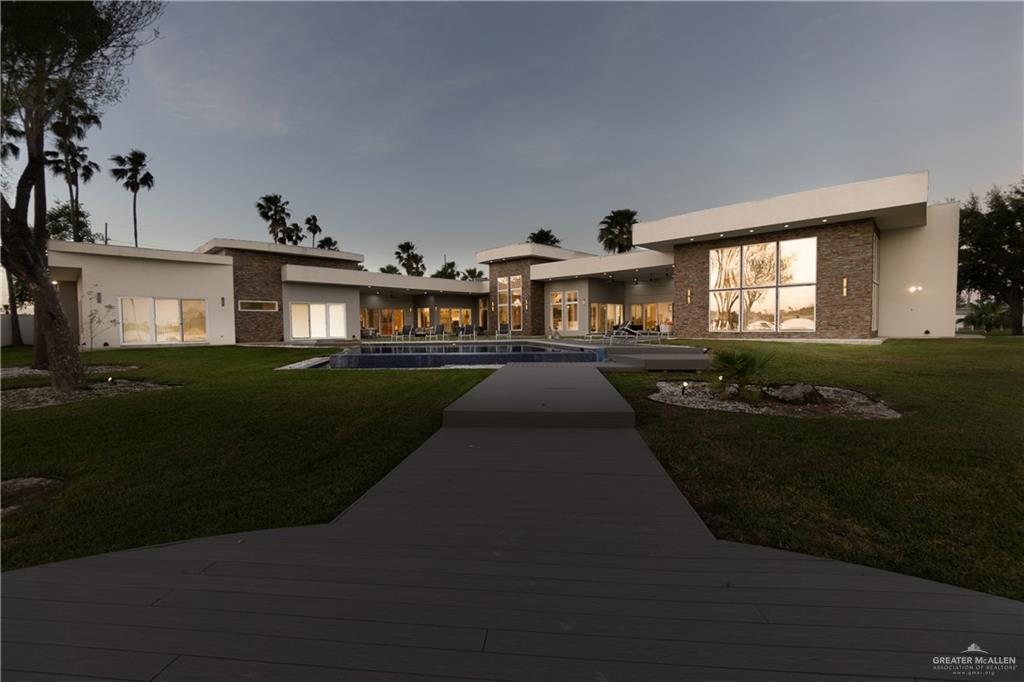 1500 Coffee Port Road Brownsville, TX 78521 - Photo 42 of 42 a front view of a house with a garden