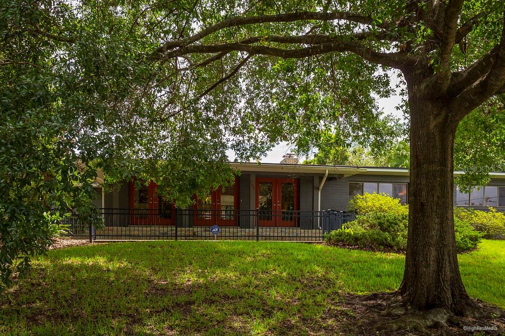 700 Balmoral Road Winter Park, FL 32789 - Photo 1 of 1 a front view of a house with garden