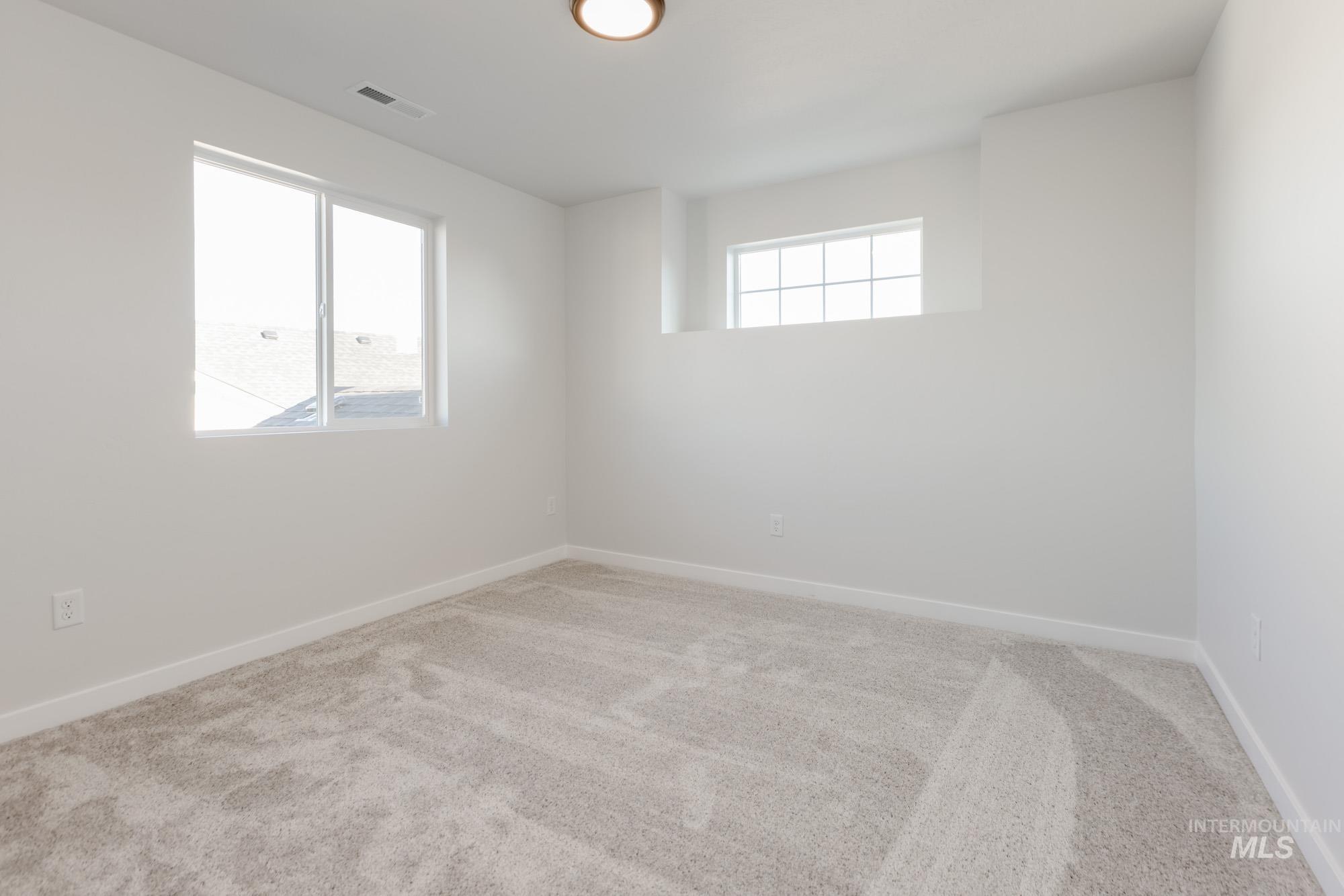1639 Celina Street Middleton, ID 83644 - Photo 19 of 19 Bright room featuring light gray carpeting, neutral painted walls, and white trim