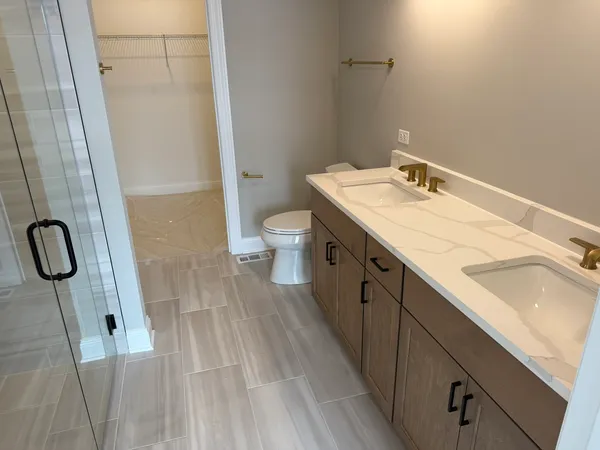 a spacious bathroom with a sink and mirror