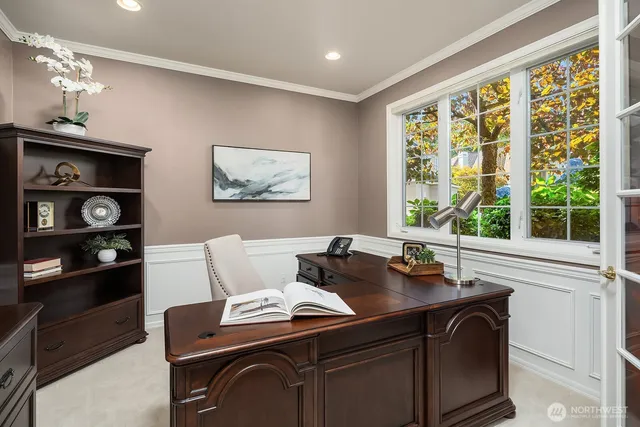 a dining room with furniture and a window