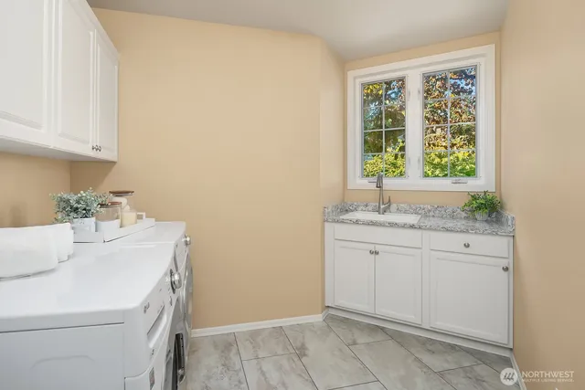 a spacious bedroom with a bed and a couch