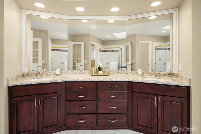 a bathroom with a bathtub and a shower