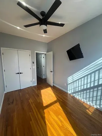 a bedroom with a bed and a walk in closet