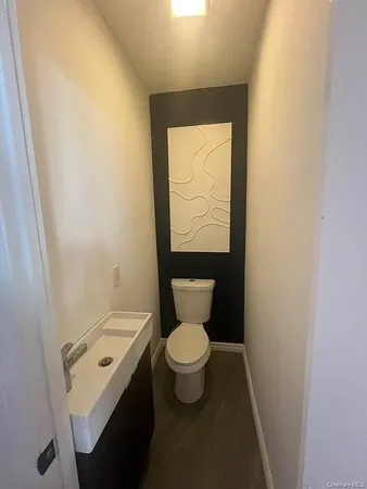 a bathroom with a toilet and a sink