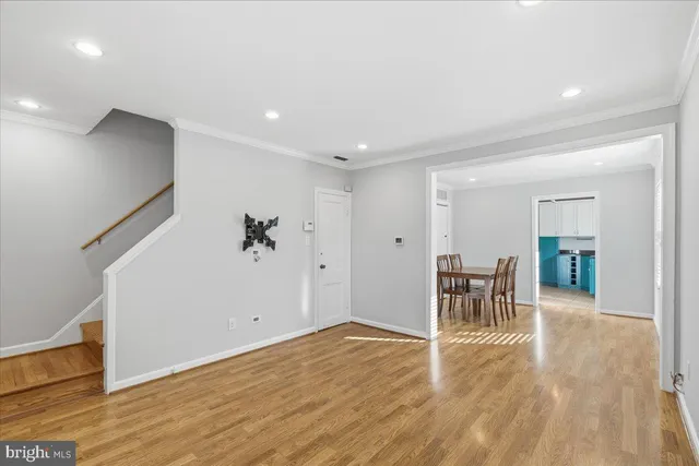 a view of a room with wooden floor
