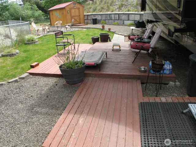 a view of backyard with small cabin