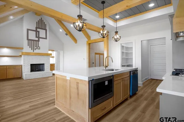 a kitchen with a stove and a fireplace