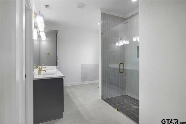 a bathroom with a sink double vanity and a mirror