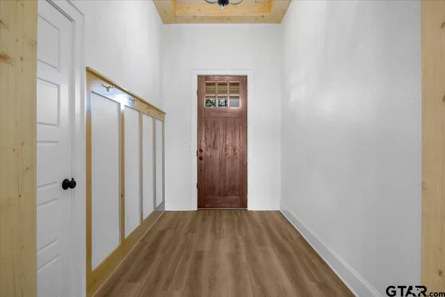 an empty room with a empty space and windows