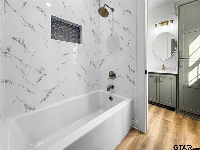 a bathroom with a sink and a mirror