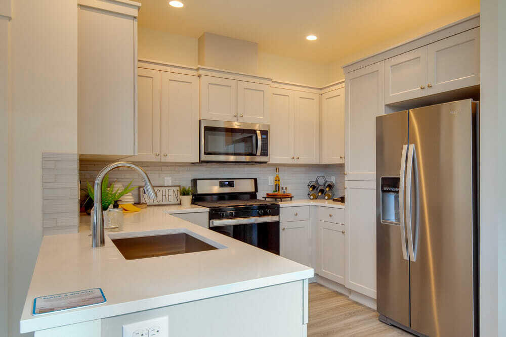 4636 Southwest 37th Street Redmond, OR 97756 - Photo 12 of 49 Sample photo, specs vary. Stove is upgraded from model shown. Kitchen with upgrade refrigerator (no longer available due to supply shortages)